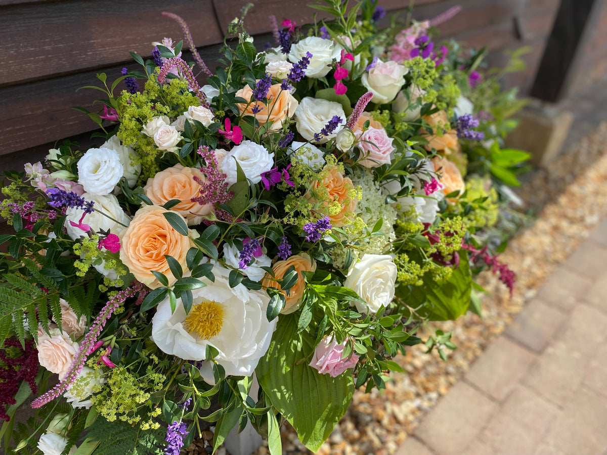 Glorious Coffin Spray of flowers, delivery locally Joannes Florist Winchester Richard Steel and Wessex Funeral.
