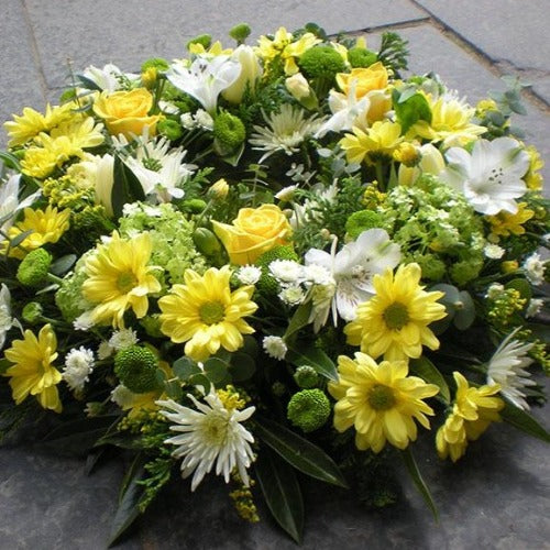 Colebrook Funeral Wreath, a cream and lime funeral wreath hand-tied by our florists in Winchester