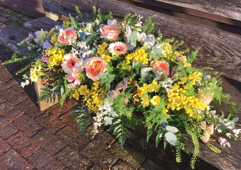 Apricot & Yellow Casket Spray hand-made by The Petal Boutique florists, available for Winchester delivery or Weyhill collecti
