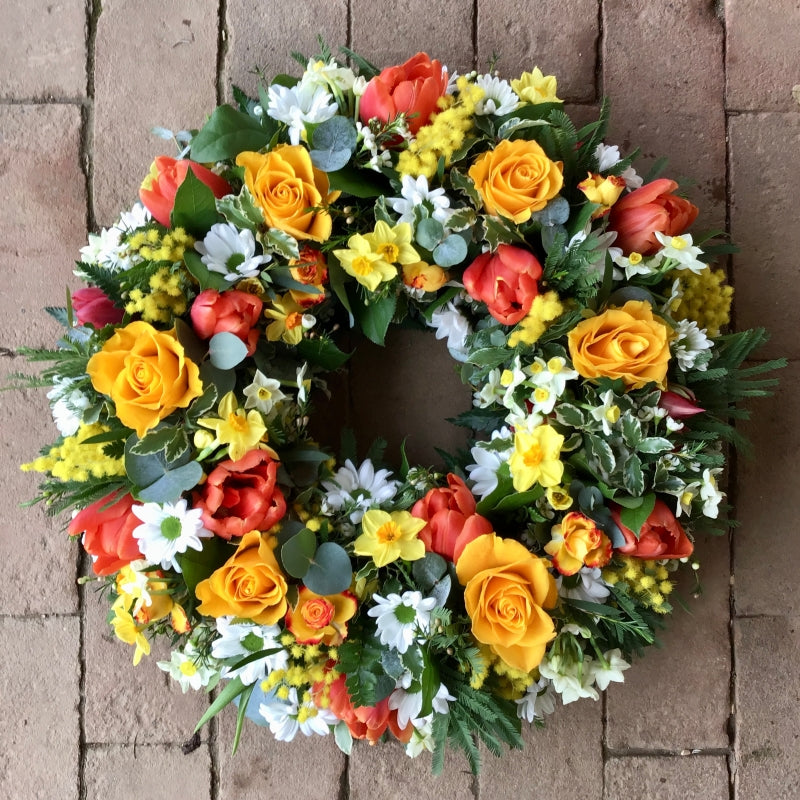 Seasonal Florists Choice Funeral Wreath hand-made by The Petal Boutique florists, available for Winchester delivery or Weyhil