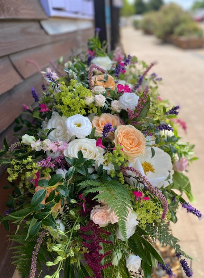 Claudius Luxury White Casket Spray. hand-made by The Petal Boutique florists, available for Winchester delivery or Weyhill co