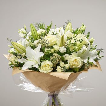 A bouquet of white roses and lilies with seasonal green foliage,Winchester Florist local delivery